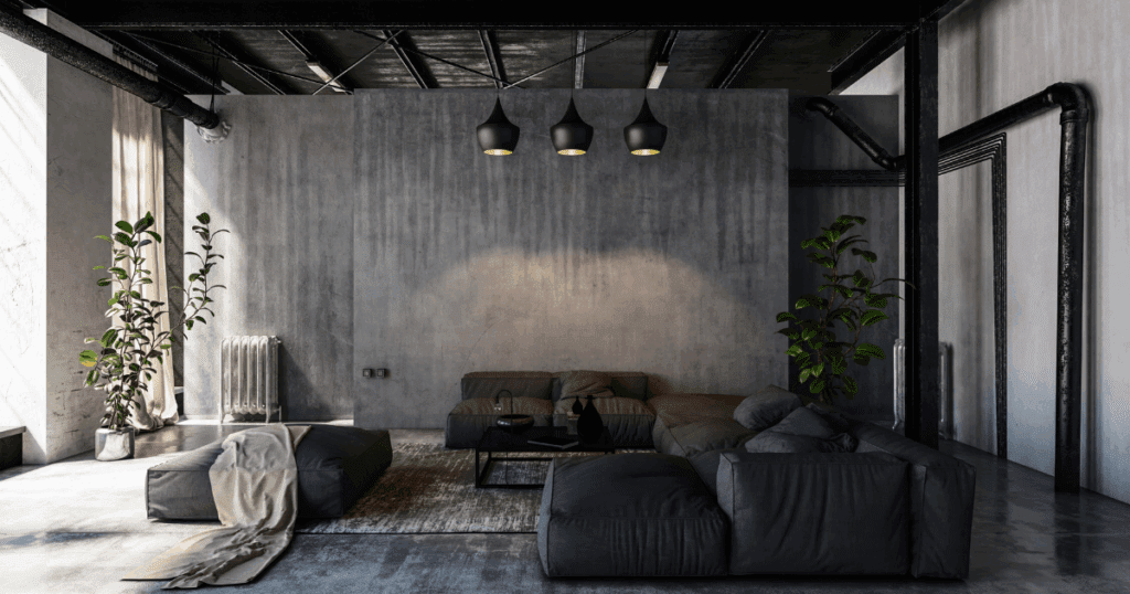 Industrial-style living room featuring dark concrete walls, matte black ceiling, and cozy modern furnishings — a great example of ceiling painting tips for modern lofts.