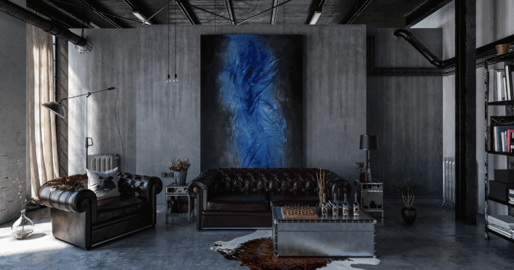 Modern industrial living room featuring a bold blue textured wall art, leather seating, and ceiling painting tips demonstrated in the matte black ceiling finish.