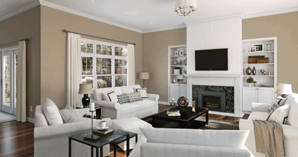 Bright and cozy living room painted in Sherwin-Williams Universal Khaki, with white trim, built-ins, and modern furnishings in neutral tones.