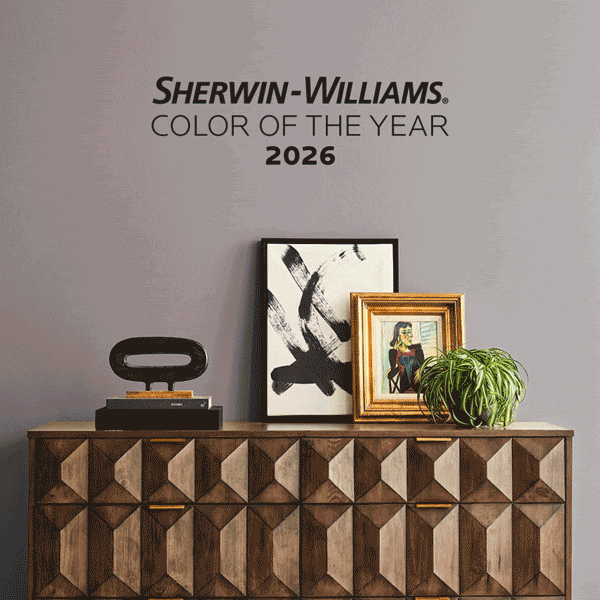 For fall painting inspiration, Sherwin-Williams 2026 Color of the Year, displayed on a wall behind a modern wood credenza with geometric paneling, decorative artwork, and a houseplant. This is a gif with the four color families: neutrals, greens, blues, and purples. The color of the wall switches to a shade from each family while the staging remains consistent.