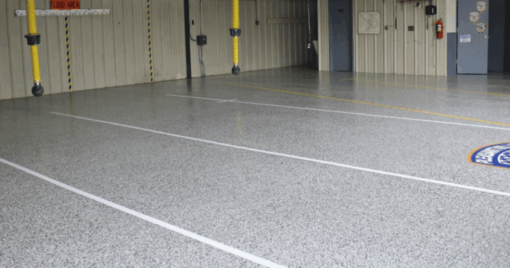 Epoxy-coated commercial garage floor with safety markings