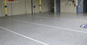 Epoxy-coated commercial garage floor with safety markings