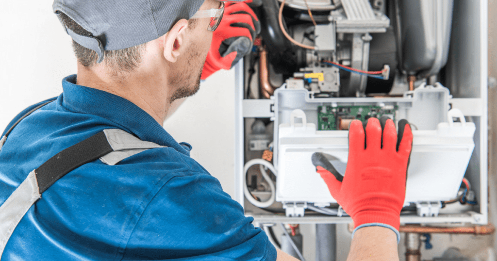 Technician inspecting and servicing a home heating system for efficiency.