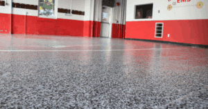 Smooth, reflective epoxy-coated floor in a red and white EMS facility.