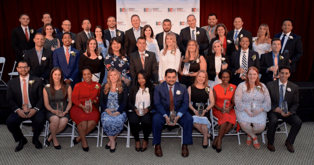 Group of Business Council of Westchester’s Rising Stars: 40 Under 40 honorees posed on stage with awards, including Paul Viggiano of A.G. Williams Painting Company.