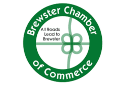 Brewster Chamber of Commerce logo with green circular design and the phrase “All Roads Lead to Brewster.”